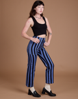 Angled front view of Black Stripe Work Pants in Cornflower Blue and black Cropped Tank on Alex