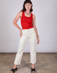 Alex is wearing Tank Top in Mustang Red paired with vintage tee off-white Work Pants