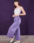 Side view of Overdyed Wide Leg Trousers in Faded Grape and Cropped Cami in vintage tee off-white on Alex