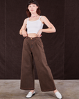 Alex is wearing Overdyed Wide Leg Trousers in Brown and Cropped Cami in vintage tee off-white