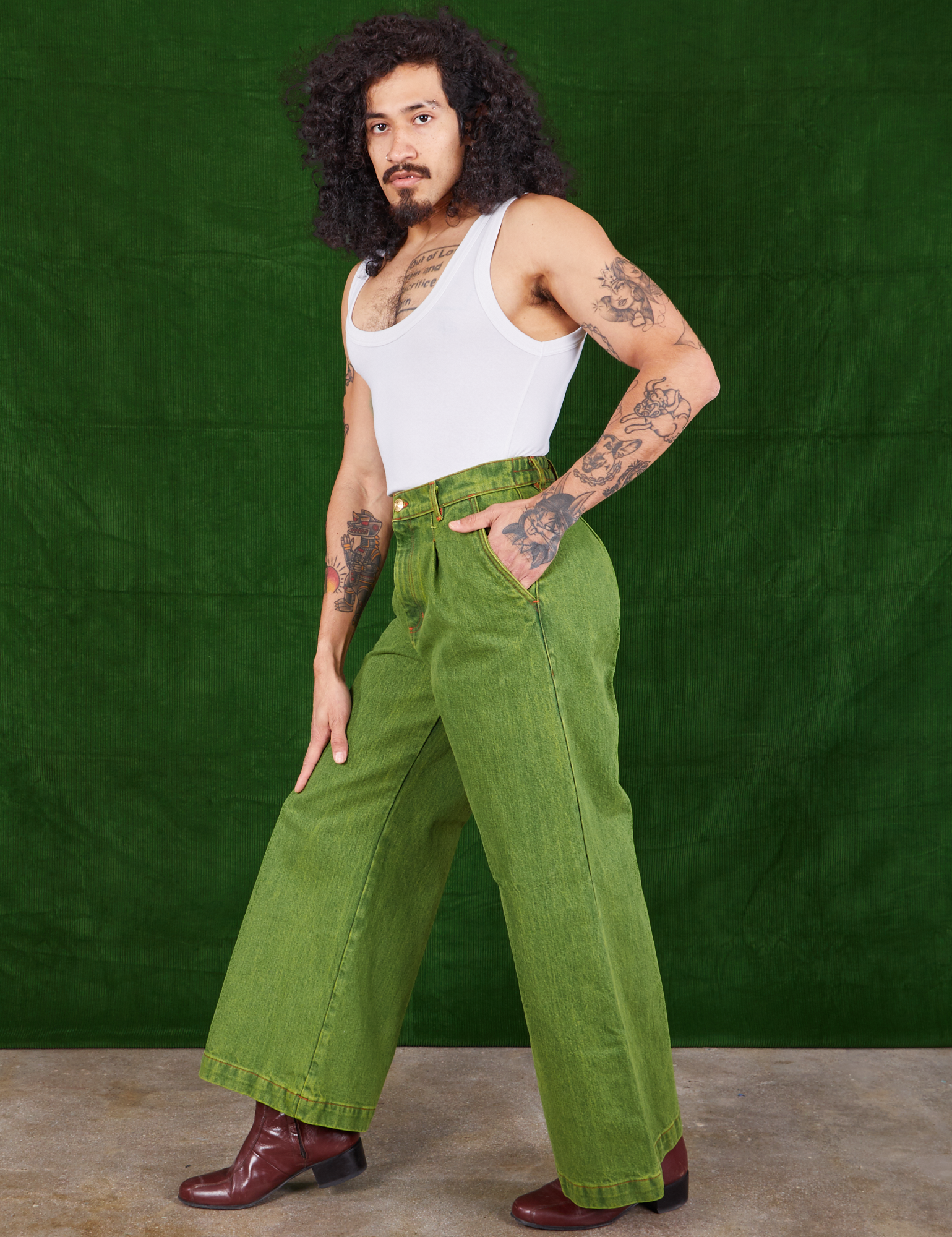 Side view of Overdyed Wide Leg Trousers in Gross Green and vintage off-white Cropped Tank Top on Jesse