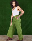 Side view of Overdyed Wide Leg Trousers in Gross Green and Cropped Tank Top in vintage tee off-white on Jesse