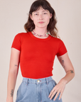 Alex is wearing Baby Tee in Mustang Red