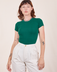 Alex is wearing Baby Tee in Hunter Green tucked into vintage off-white Heavy Weight Trousers