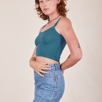 Side view of Cropped Cami in Marine Blue and light wash Frontier Jeans worn by Alex