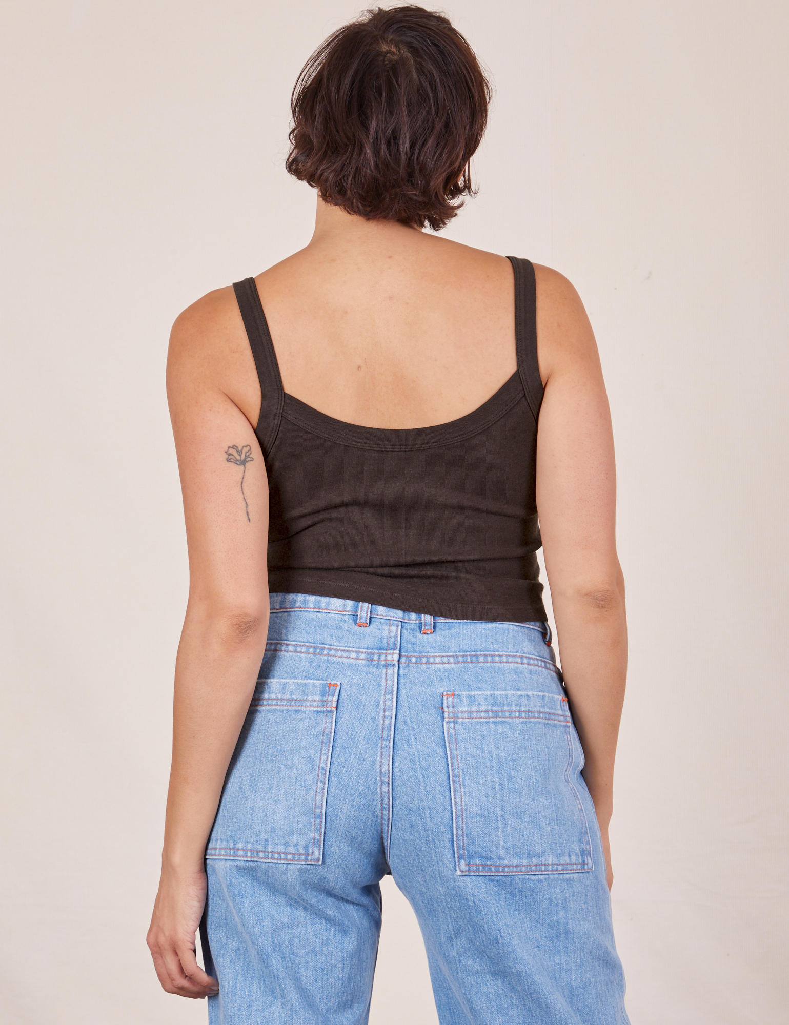Back view of Cropped Cami in Espresso Brown and light wash Sailor Jeans worn by Tiara