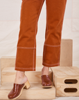 Carpenter Jeans in Burnt Terracotta pant leg close up on Alex