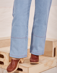 Pant leg close up of Carpenter Jeans in Light Wash worn by Tiara
