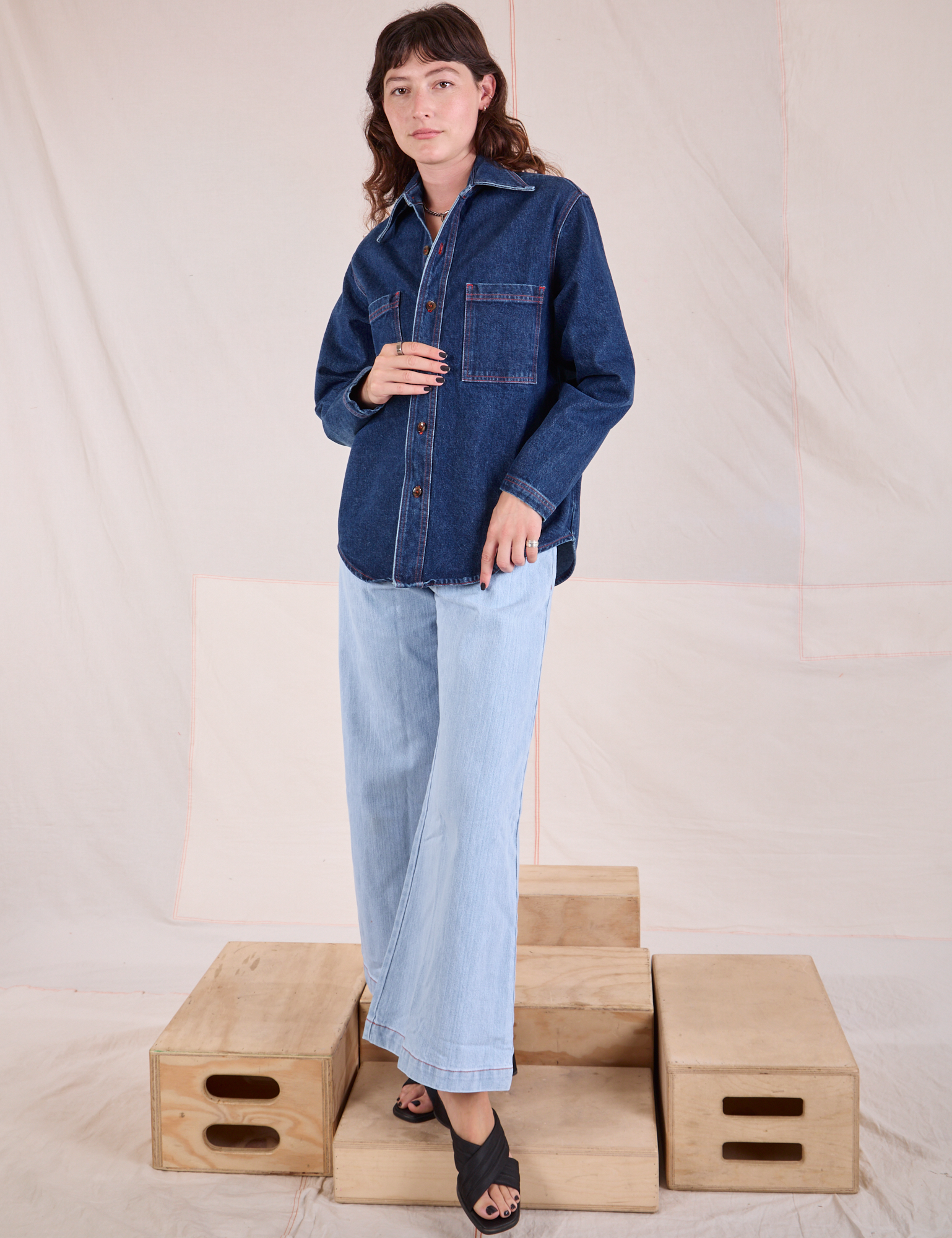 Alex is wearing Denim Overshirt in Dark Wash and light wash Wide Leg Denim Trousers