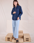 Alex is wearing Denim Overshirt in Dark Wash and light wash Wide Leg Denim Trousers