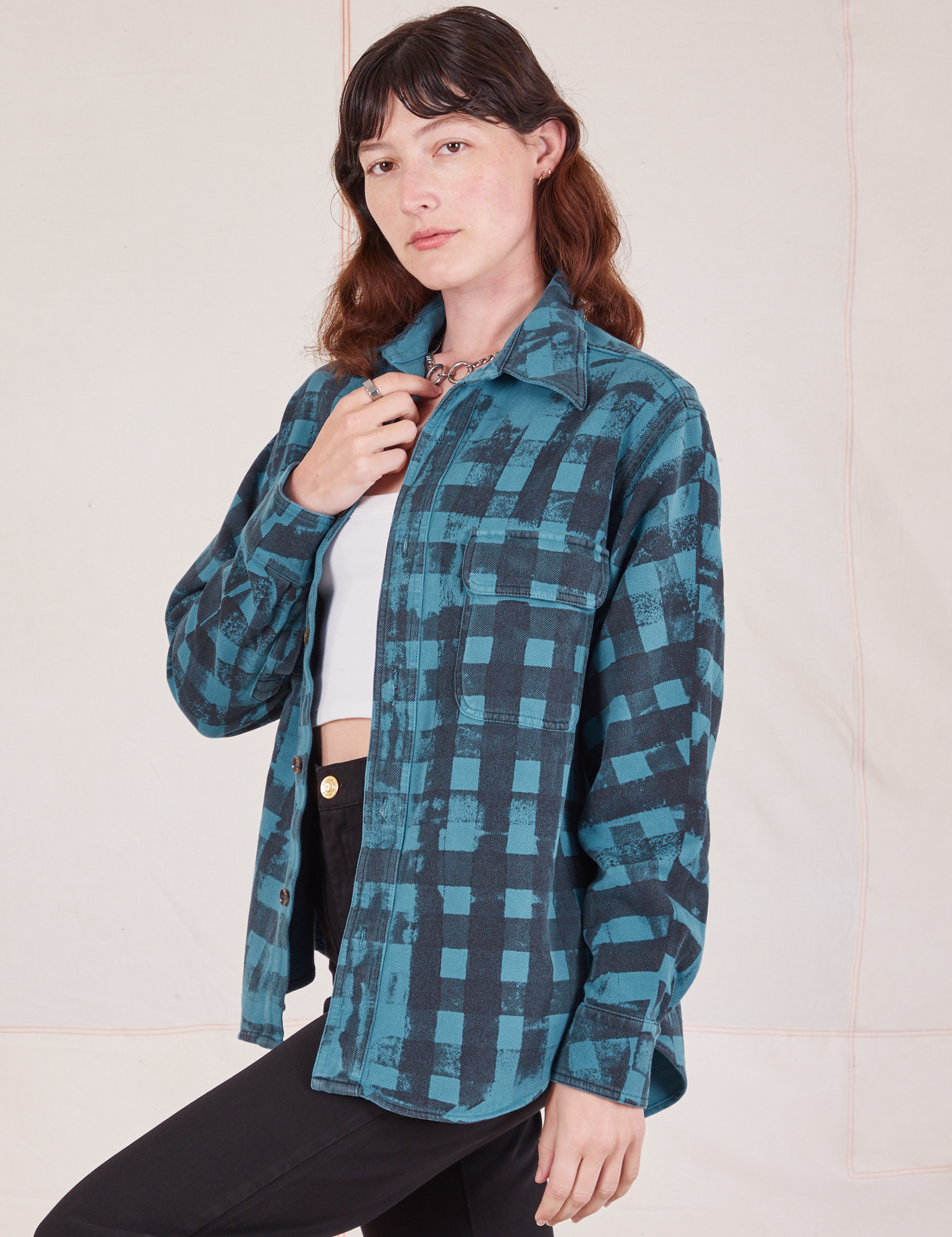 Angled view of Plaid Flannel Overshirt in Marine Blue on Alex