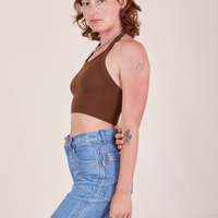 Side view of Halter Top in Fudgesicle Brown and light wash Frontier Jeans worn by Alex