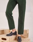 Heritage Short Sleeve Jumpsuit in Swamp Green pant leg close up on Alex