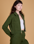 Angled front view of Heritage Mechanic Jacket in Evergreen on Alex