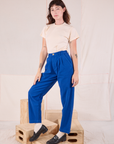Angled front view of Heritage Trousers in Royal Blue and Organic Vintage Tee in vintage tee off-white