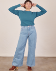 Tiara is wearing Honeycomb Thermal in Marine Blue tucked into light wash Sailor Jeans