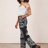 Side view of Icon Work Pants in Dice and vintage off-white Cropped Cami worn by Jesse