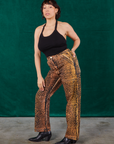 Angled front view of Leopard Work Pants and black Halter Top on Tiara