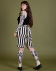 Longline Work Shorts in Natural angled back view on Sydney