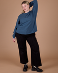Lish is wearing Long Sleeve Burly Tee in French Blue and black Work Pants