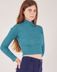 Essential Turtleneck in Marine Blue angled front view of Scarlett