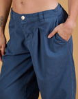 Close up of Alex's hand in the front pocket of Baggy Mid-Rise Trousers in French Blue