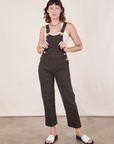 Alex is wearing Original Overalls in Mono Espresso with Cropped Tank Top in vintage tee off-white