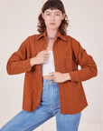 Alex is wearing Oversize Overshirt in Burnt Terracotta