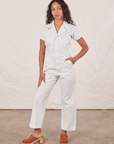 Blair is wearing Petite Short Sleeve Jumpsuit in Vintage Tee Off-White