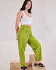Angled front view of Heavyweight Trousers in Gross Green and Cropped Tank in vintage tee off-white
