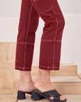 Railroad Carpenter Jeans in Mustang Red side pant leg close up on Alex