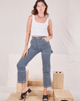 Alex is wearing Carpenter Jeans in Indigo Railroad and vintage tee off-white Square Neck Tank