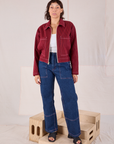 Tiara is wearing Mechanic Jacket in Mustang Red paired with dark wash Carpenter Jeans