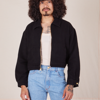 Ricky Jacket in Basic Black and a vintage off-white Tank Top worn by Jesse