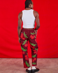 Back view of Paintstamped Work Pants in Cherry and Cropped Tank in vintage tee off-white on Jerrod