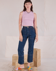 Alex is wearing Muscle Tee in Lilac and dark wash Carpenter Jeans