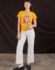 Alex is wearing Wicker Park Tourist Tee and vintage tee off-white Western Pants