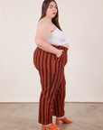 Side view of Black Striped Work Pants in Paprika on Marielena