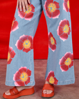 Wide Leg Denim Trousers in Painted Flowers pant leg close up on Alex