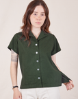 Hana is wearing Pantry Button-Up in Swamp Green