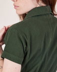 Petite Short Sleeve Jumpsuit in Swamp Green back shoulder close up on Hana