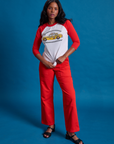 Kandia is 5'3" and wearing XS Taxi Raglan Tee in NYC paired with mustang red Work Pants