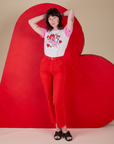 Alex is wearing Vintage Tee in Cupid paired with mustang red Work Pants