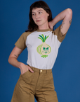 Alex is wearing Produce Raglan Tee in Onion