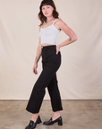 Side view of Western Pants in Basic Black and Cropped Cami worn by Alex