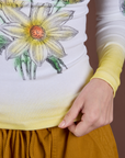 Floral Long Sleeve Baby Tee in Yellow bottom close up on Madeline