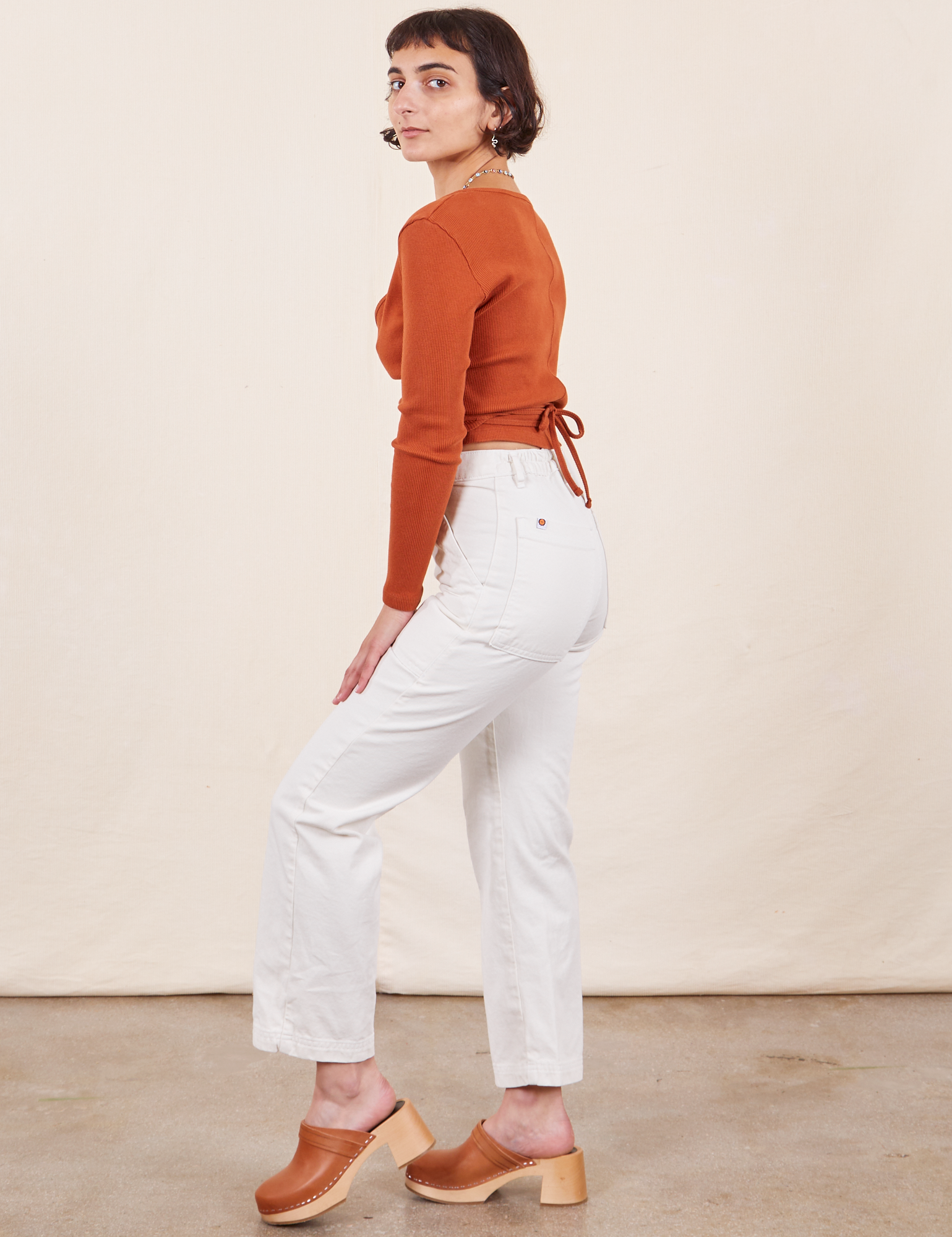 Work Pants in Vintage Off-White side view on Soraya wearing a burnt terracotta Wrap Top