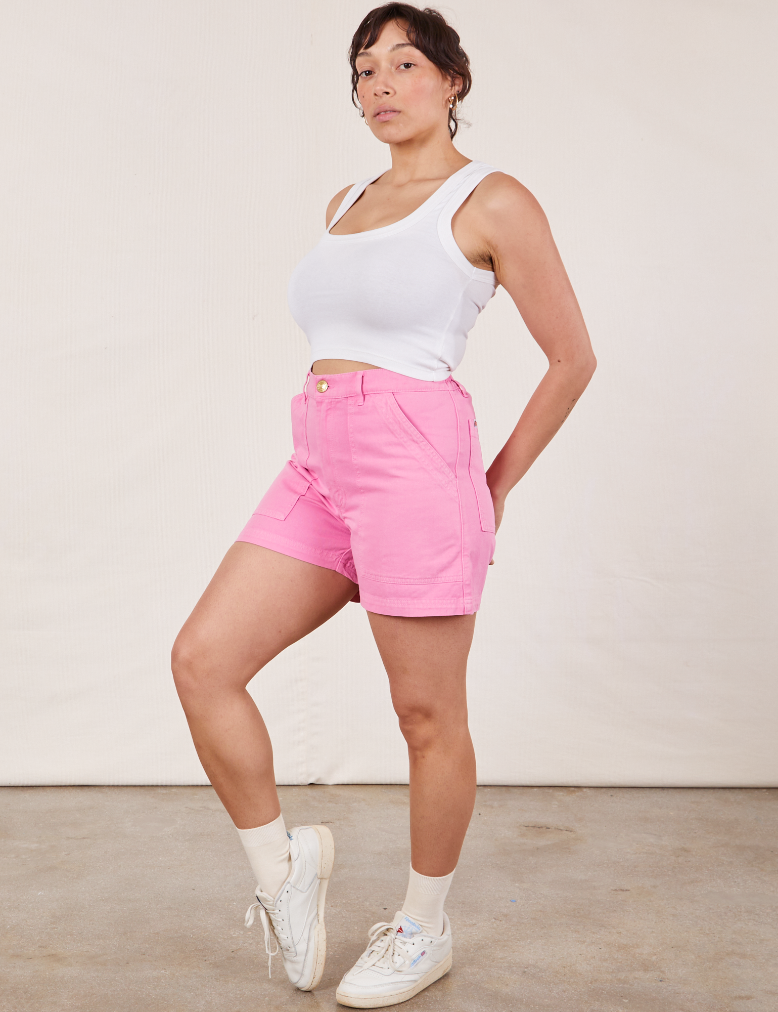 Angled front view of Classic Work Shorts in Bubblegum Pink and Cropped Tank Top in vintage tee off-white on Tiara