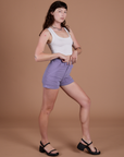 Angled front view of Classic Work Shorts in Faded Grape and Cropped Tank in Vintage Tee White