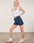 Angled front view of Classic Work Shorts in Lagoon and Cropped Tank Top in vintage tee off-white